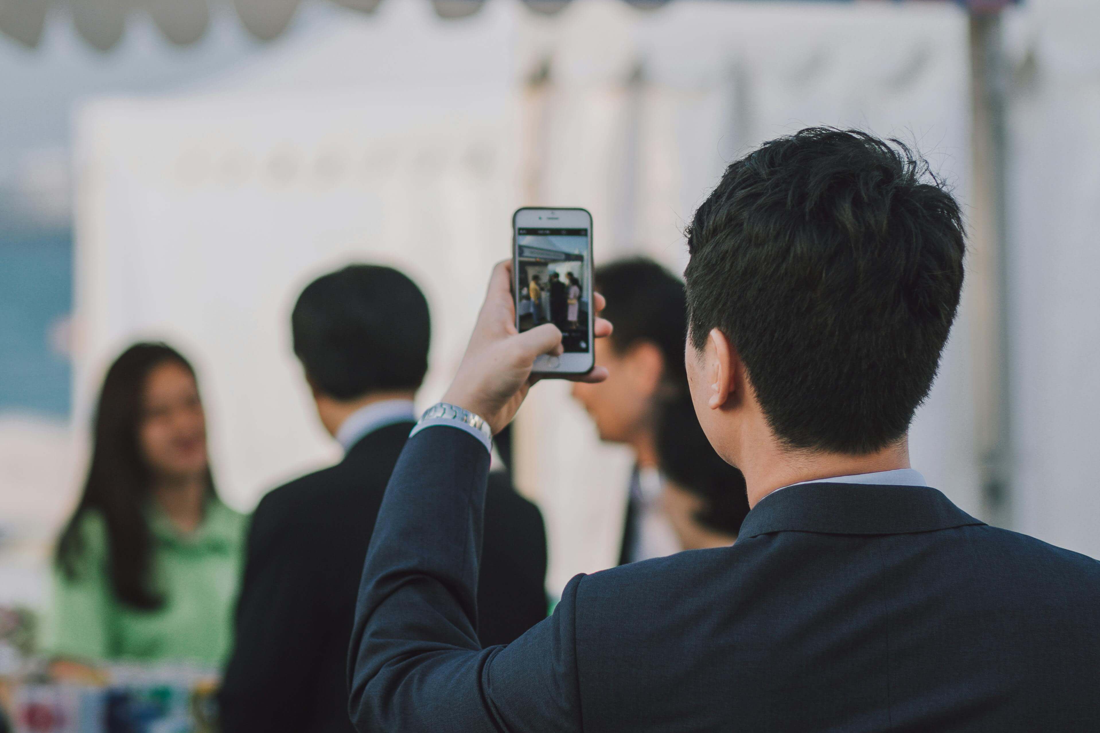 Modern newsroom with journalists collaborating on verified content
